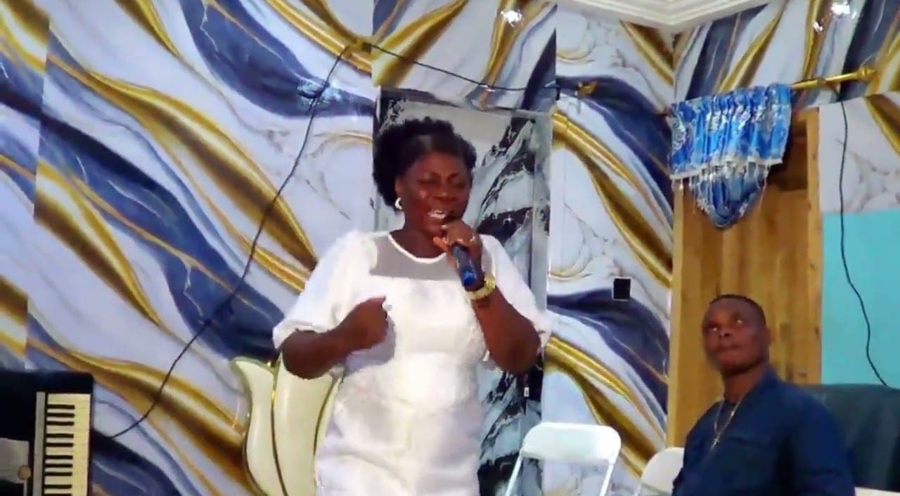 A minister leading live worship in the Crown studio