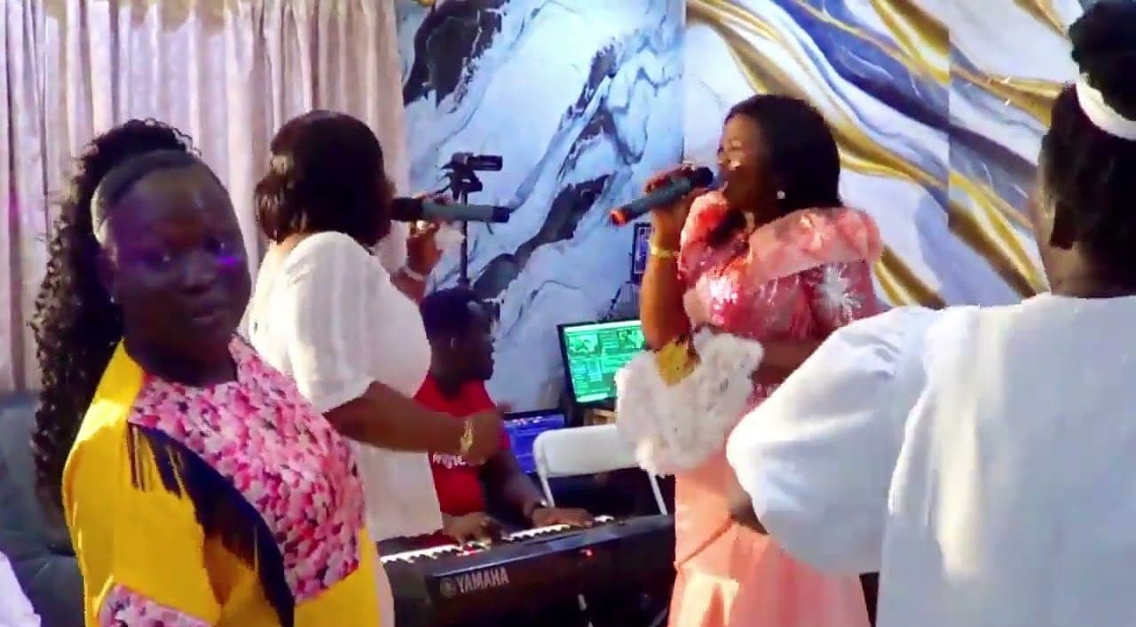 Singers and a keyboardist during a live worship session in the Crown studio